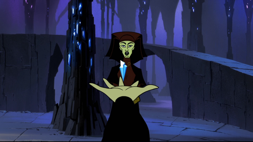 Barriss Offee holds a lightsaber crystal before Luminara
